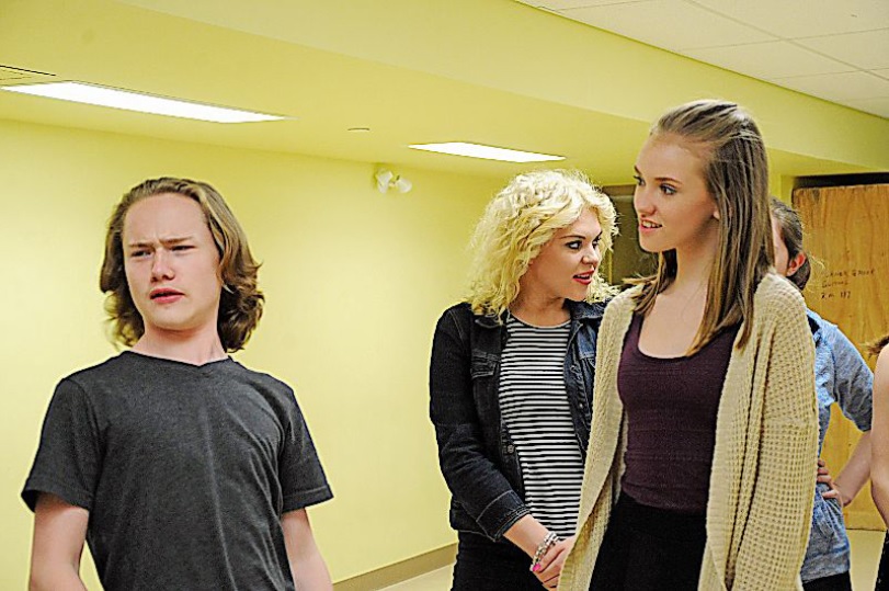 Many students, including Noah Hamilton (l) Julia Gardner (m) and Alexandra Payne (r) are reheasing for the big opening night of Grease (Photo credit: The Western Star)