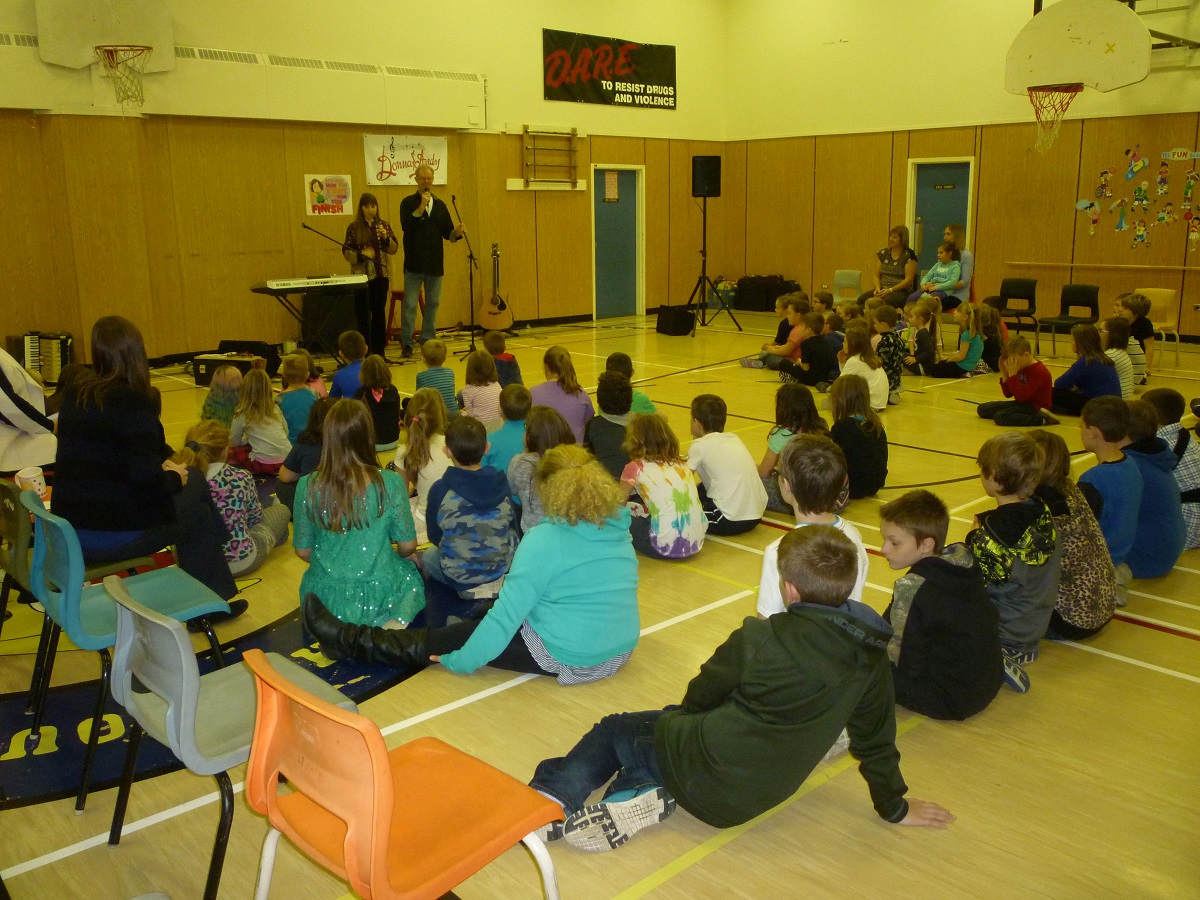 Donna and Andy perform for students and staff