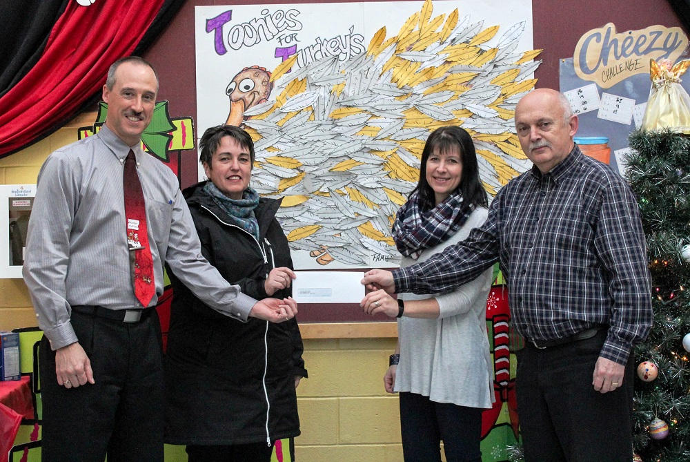 Presenting the cheque to Helping Hand (L to R); School Principal Paul Brown, Helping Hands Coordinator Darlene Kearley, School Counselor & Committee Chairperson Kerri Morgan, and School Assistant Principal Roy Sparkes. 