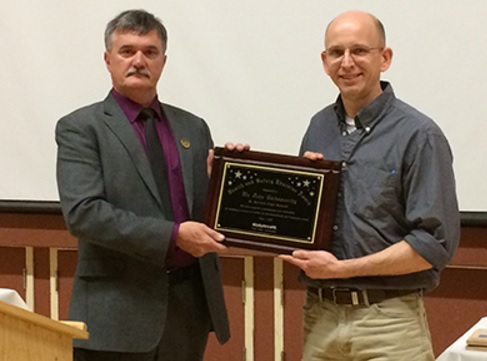 St. Kevin's High School teacher John Goldsworthy receives the Health and Safety Educator of the Year Award for 2016/2017 from WorkplaceNL Executive Director Brian Delaney.